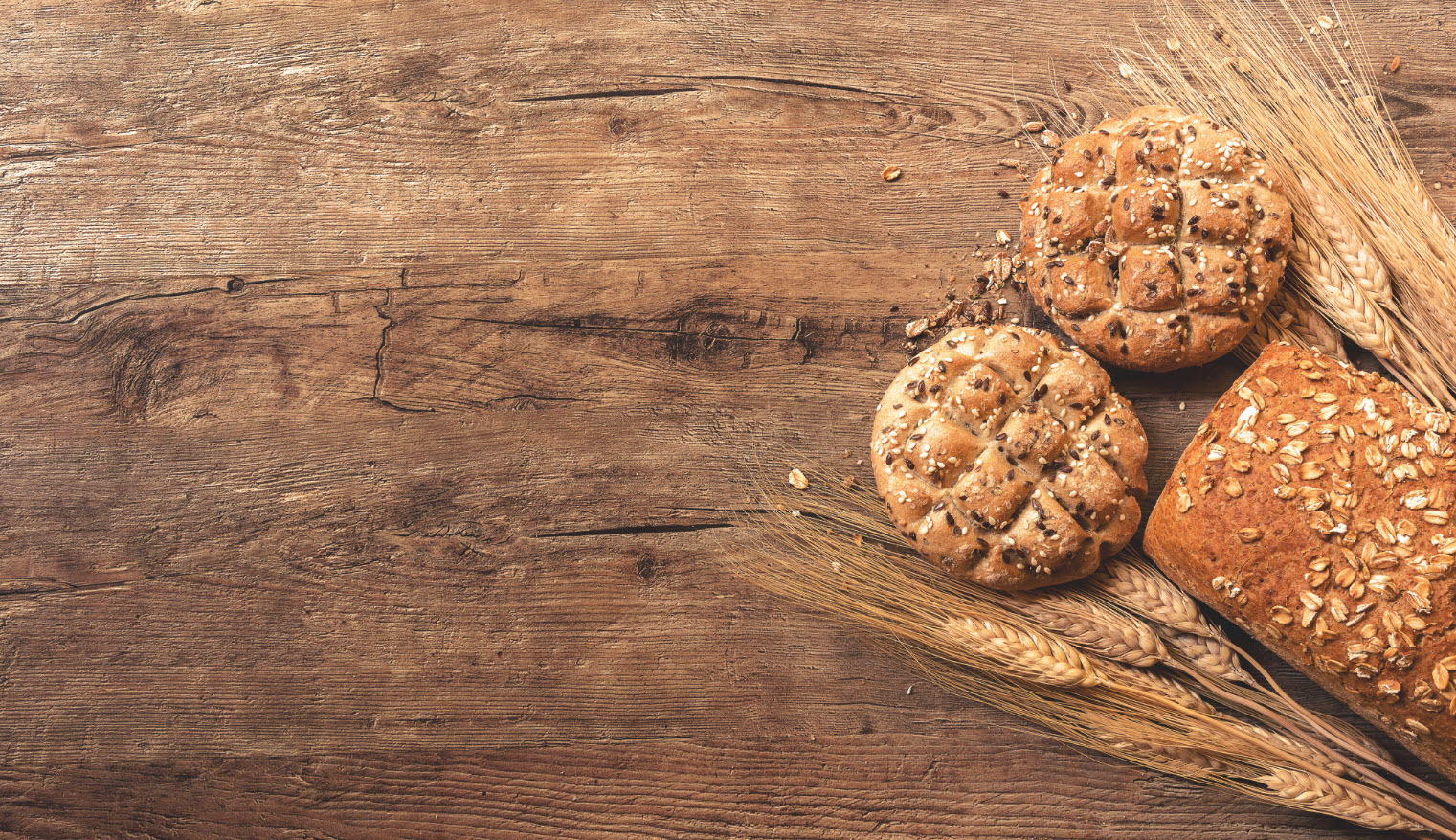 Grain and Bread displayed on a wooden board